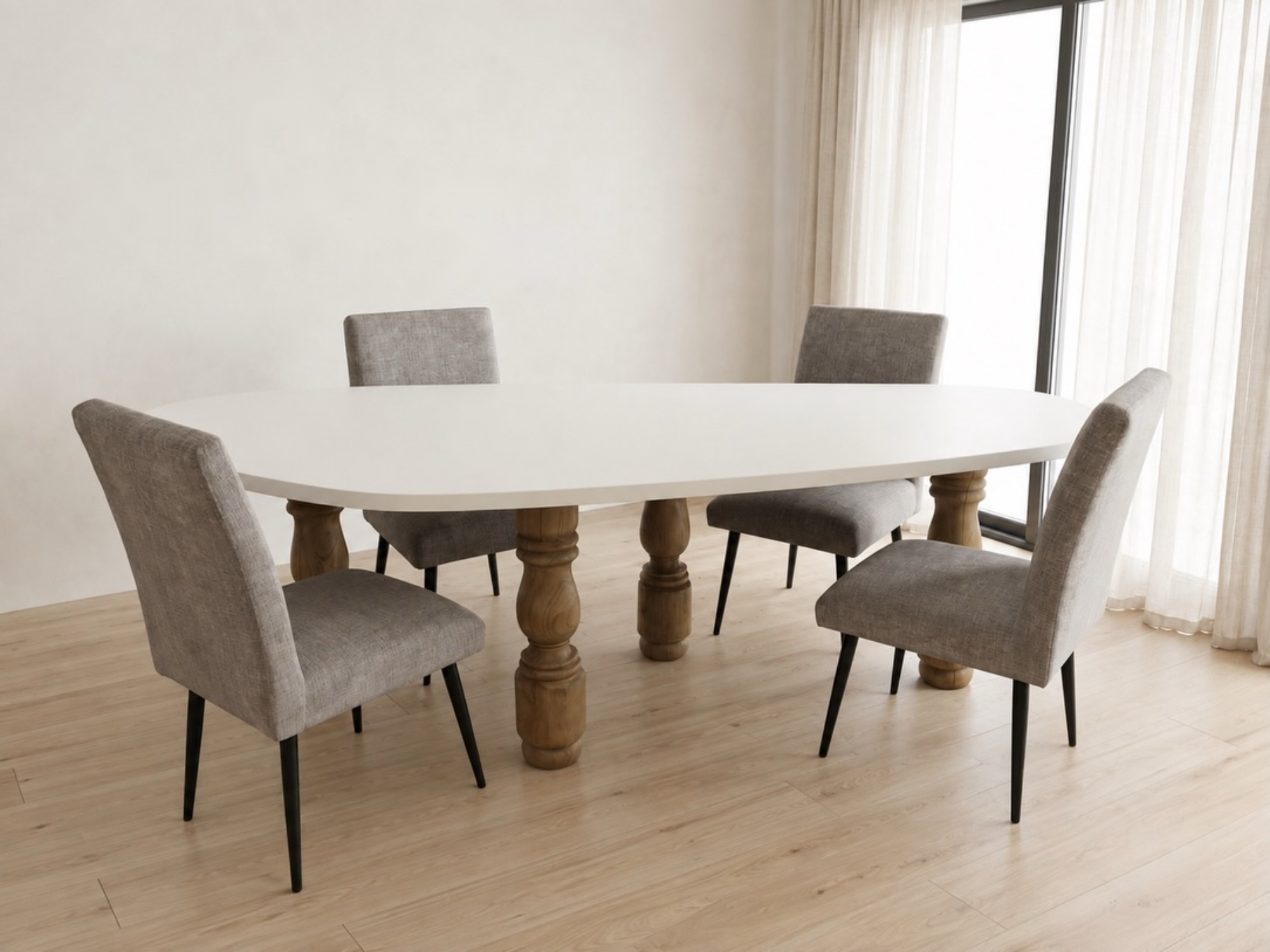 Oval dining table with turned wood legs and grey chairs